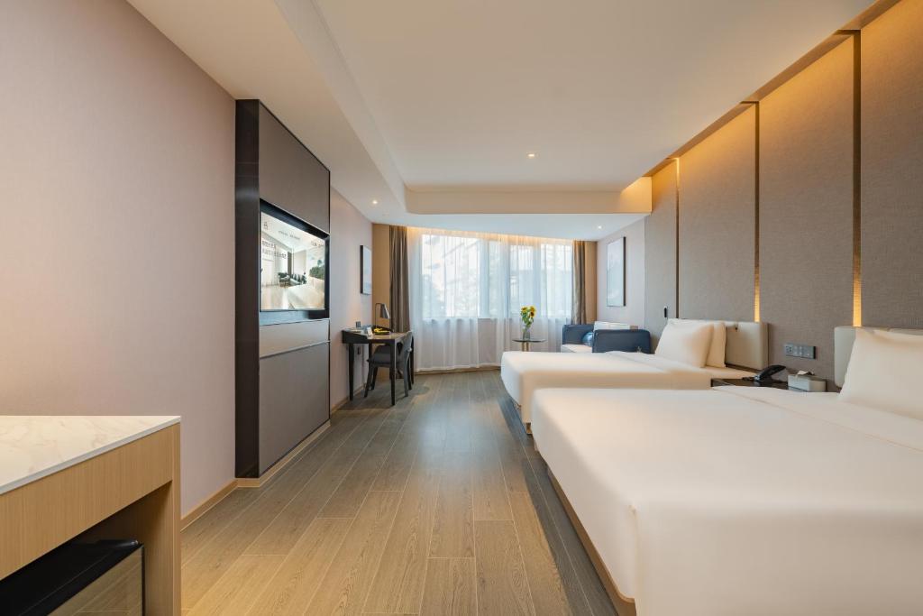 Postel nebo postele na pokoji v ubytování Atour Hotel Shanghai Jiading Juyuan Wisdom Center