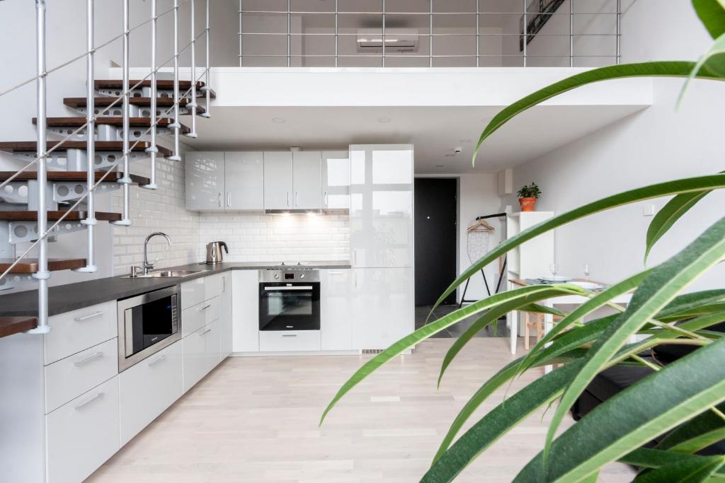 Kuchyň nebo kuchyňský kout v ubytování Uptown Lofts