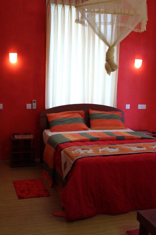 Postel nebo postele na pokoji v ubytování Raj Mahal Inn