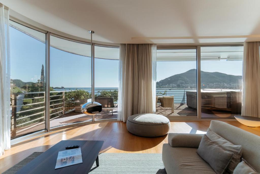 a living room with a view of the ocean at Luxury Waterfront Villa at Dukly Gardens in Budva