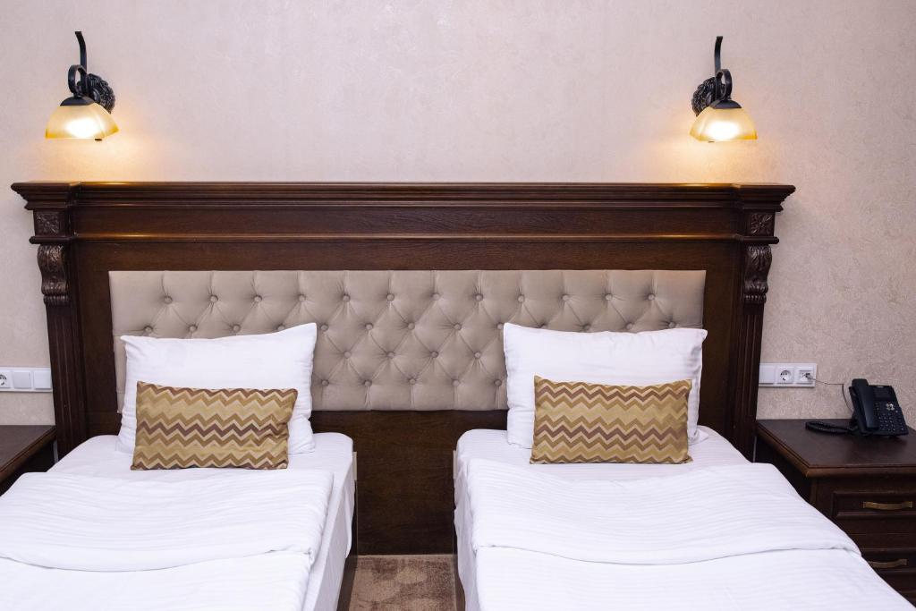 Postel nebo postele na pokoji v ubytování Hotel Imperial House