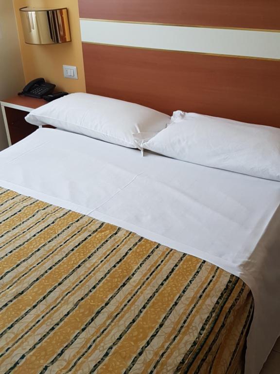 Postel nebo postele na pokoji v ubytování Hotel GF