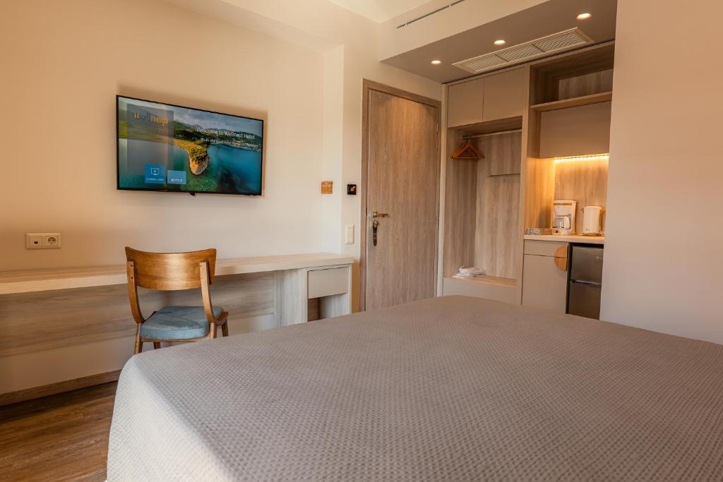 Postel nebo postele na pokoji v ubytování Wellnest Hotel