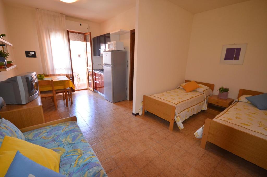 A bed or beds in a room at Residence Valbella