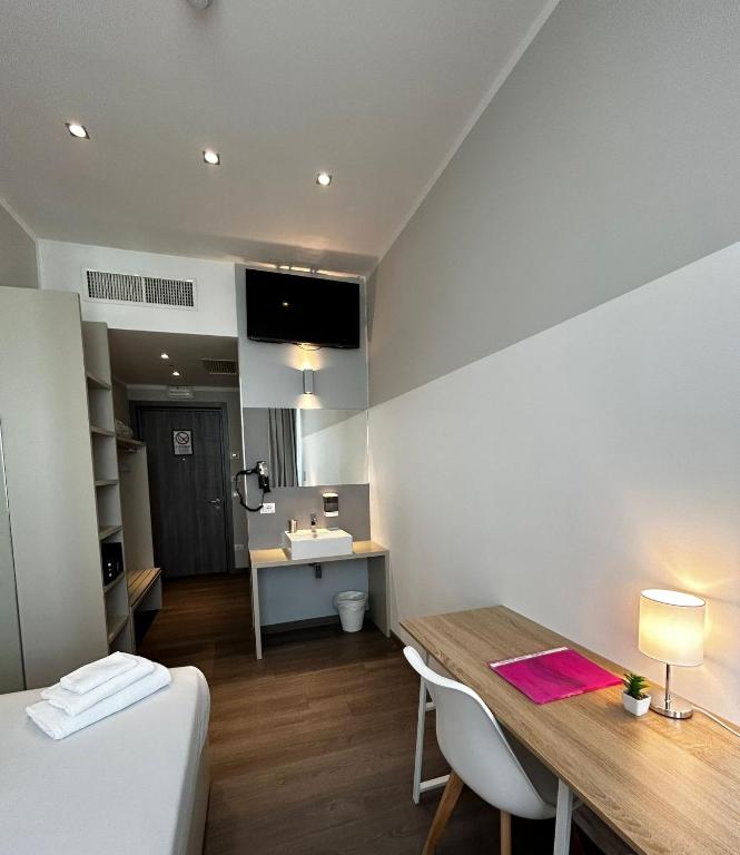 Postel nebo postele na pokoji v ubytování Fasthotel Linate