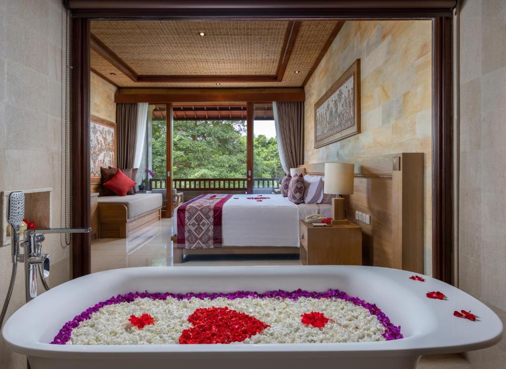 Postel nebo postele na pokoji v ubytování Pita Maha Resort & Spa
