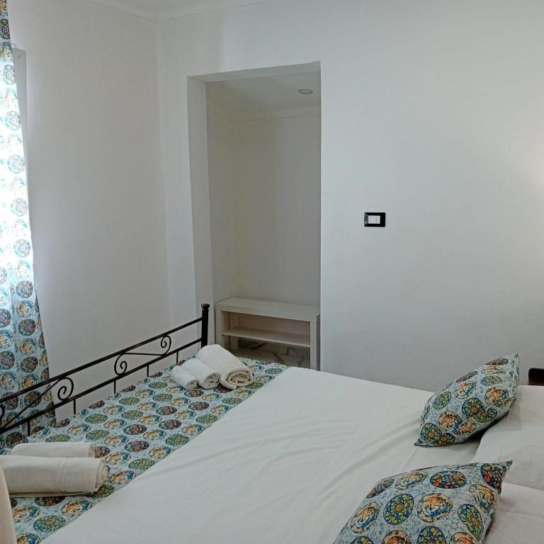 Postel nebo postele na pokoji v ubytování Oasi del mare