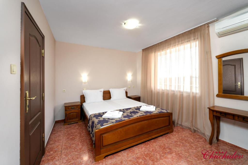 Postel nebo postele na pokoji v ubytování Hotel Chuchulev