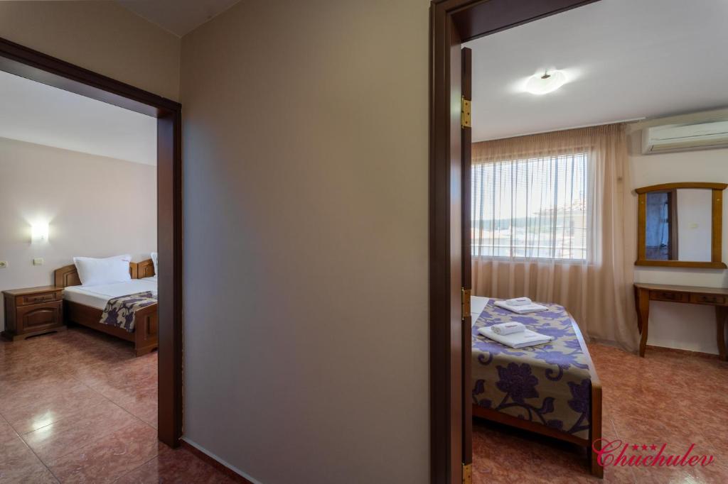 Postel nebo postele na pokoji v ubytování Hotel Chuchulev