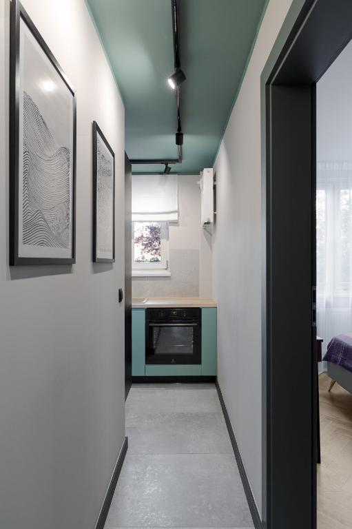 Televízia a/alebo spoločenská miestnosť v ubytovaní Apartament nad morzem