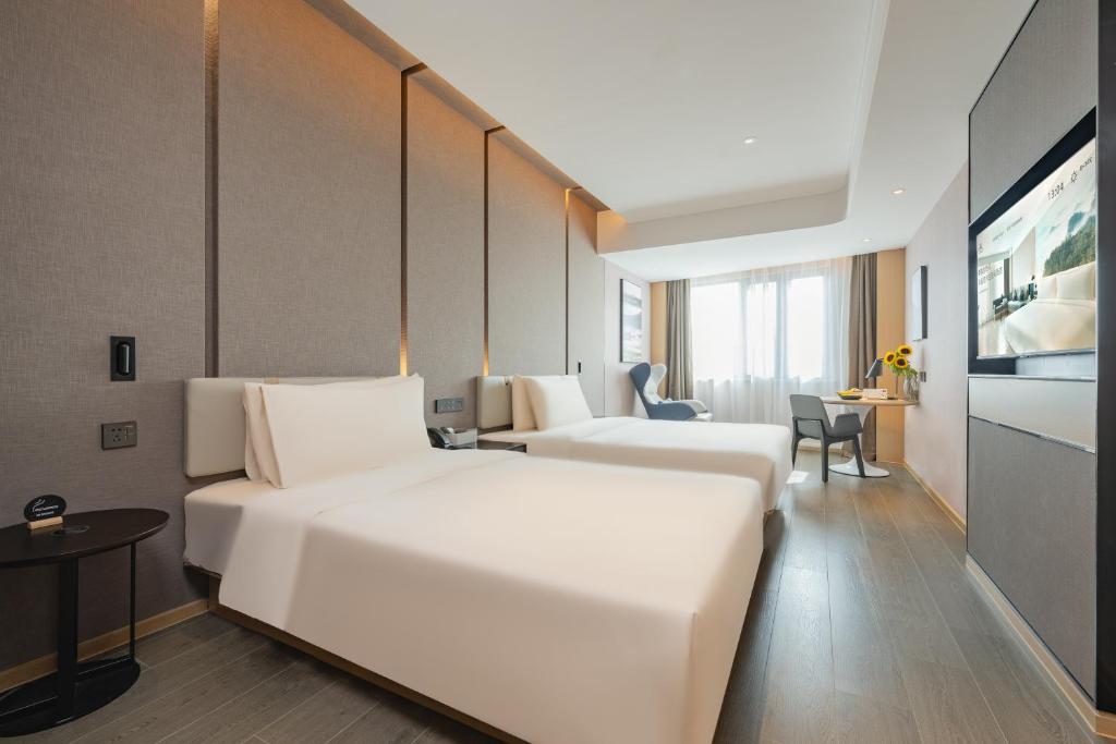 Postel nebo postele na pokoji v ubytování Atour Hotel Shanghai Jiading Juyuan Wisdom Center