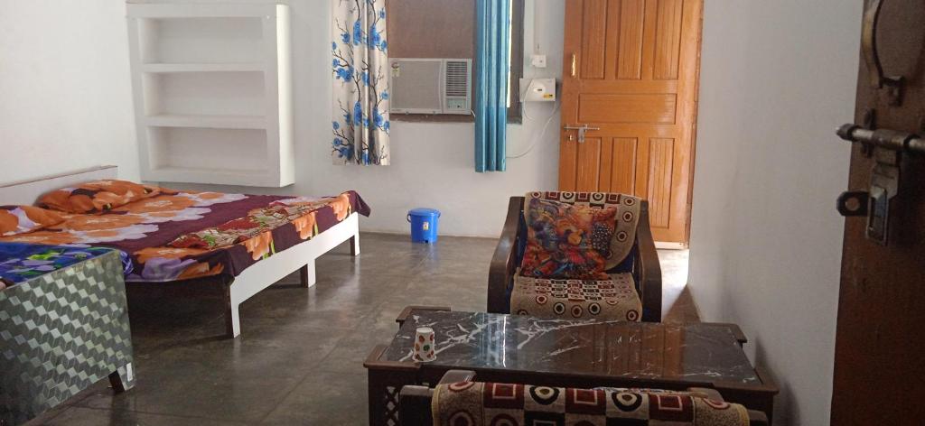 Voodi või voodid majutusasutuse Rashi home stay toas