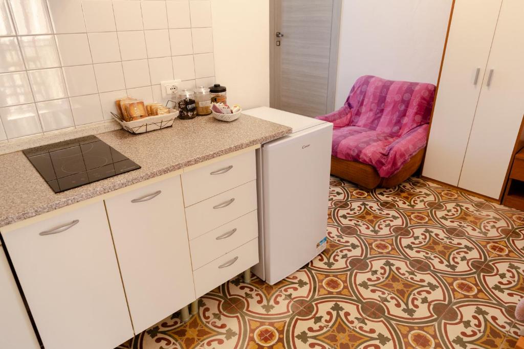 Kuchyň nebo kuchyňský kout v ubytování B&B La Ciammaruca