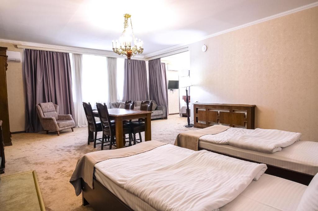 Postel nebo postele na pokoji v ubytování Hotel Imperial House