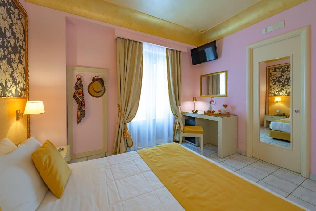 Postel nebo postele na pokoji v ubytování Fazio Rooms