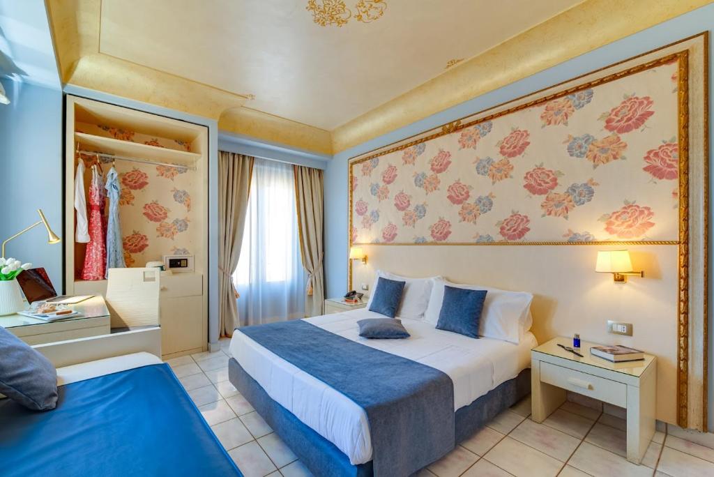 Postel nebo postele na pokoji v ubytování Fazio Rooms