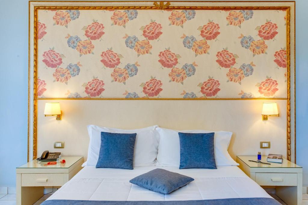 Postel nebo postele na pokoji v ubytování Fazio Rooms