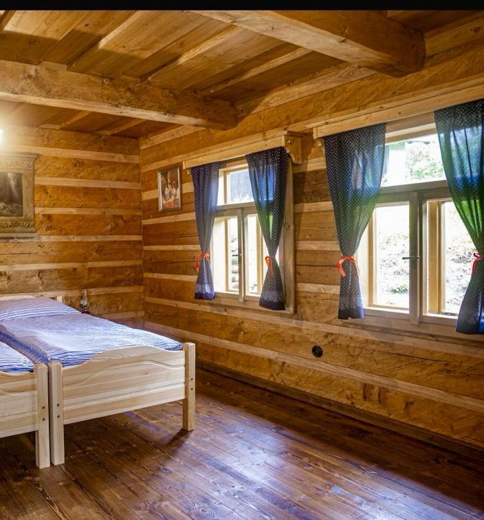 Postel nebo postele na pokoji v ubytování Chalupy Pod Šenkem - Výminek