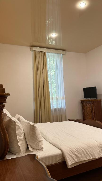 Postel nebo postele na pokoji v ubytování Wald Hotel Lagodekhi