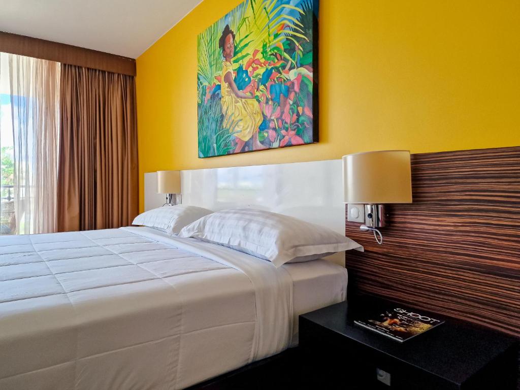 Postel nebo postele na pokoji v ubytování Hommage Hotel & Residences