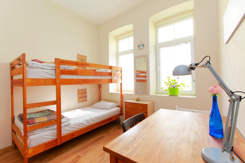 Postel nebo postele na pokoji v ubytování Nomado Hostel