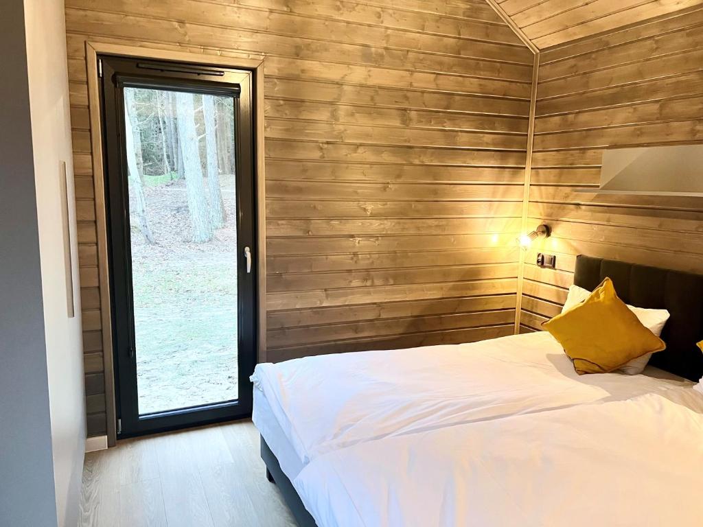 Postel nebo postele na pokoji v ubytování Ruciane Park - Mazury resort & spa