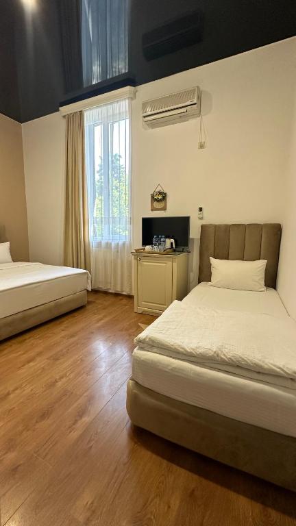 Postel nebo postele na pokoji v ubytování Wald Hotel Lagodekhi
