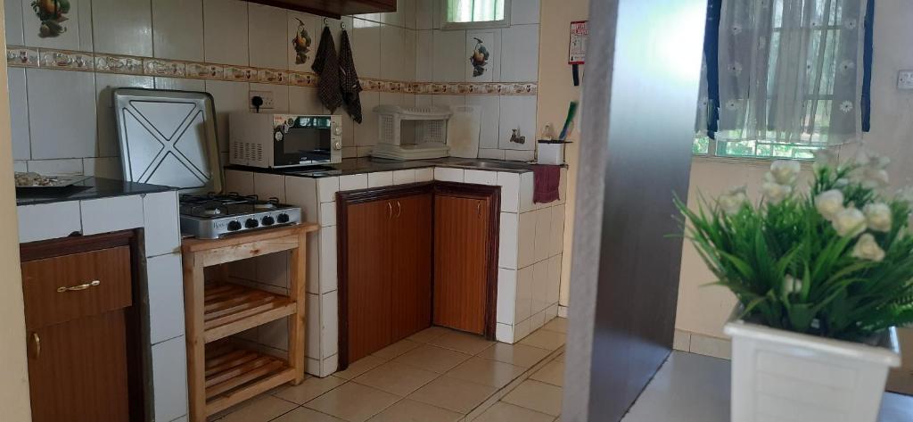 Kuchyň nebo kuchyňský kout v ubytování Kisumu Airport view 2br apartment house