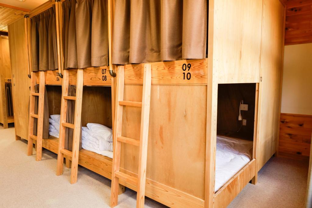 Postel nebo postele na pokoji v ubytování 馬籠ふるさと学校 Magome Furusato Gakkou