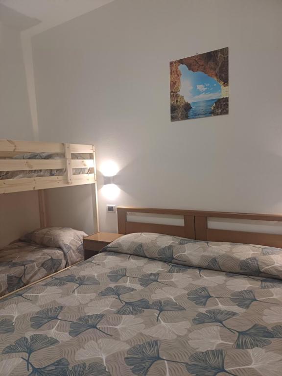 Postel nebo postele na pokoji v ubytování Hotel Flora