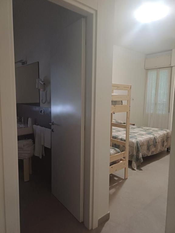 Postel nebo postele na pokoji v ubytování Hotel Flora