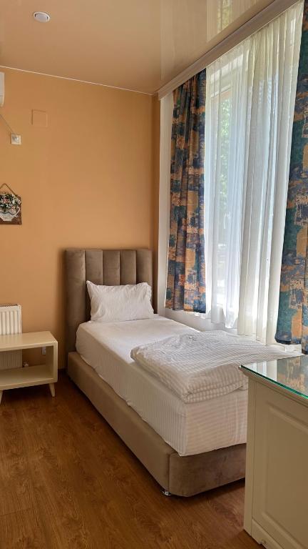 Postel nebo postele na pokoji v ubytování Wald Hotel Lagodekhi