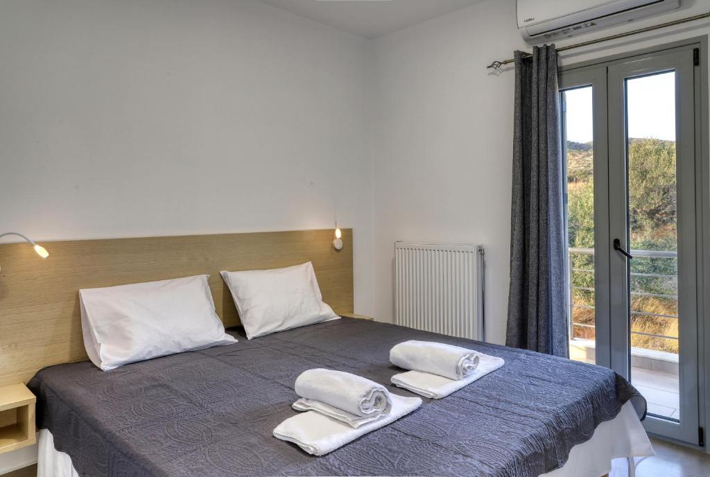 Posteľ alebo postele v izbe v ubytovaní Helios Studios & Apartments