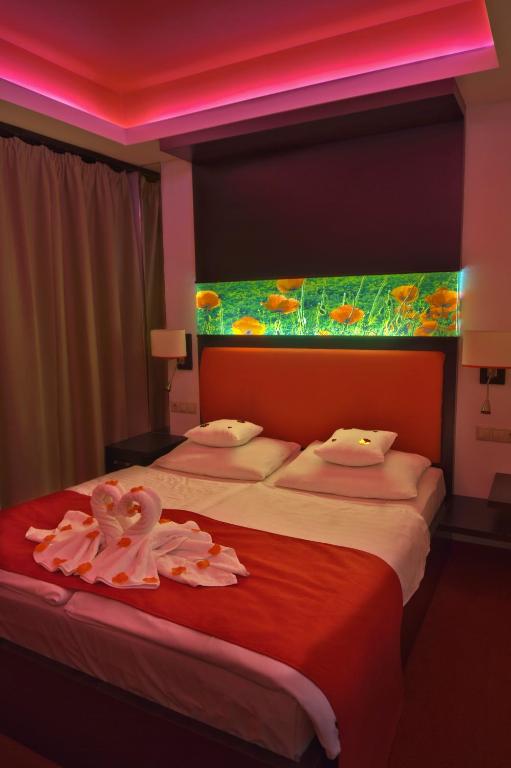 Posteľ alebo postele v izbe v ubytovaní Corso Boutique Hotel