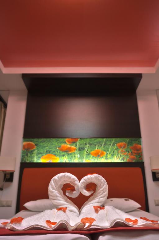 Posteľ alebo postele v izbe v ubytovaní Corso Boutique Hotel