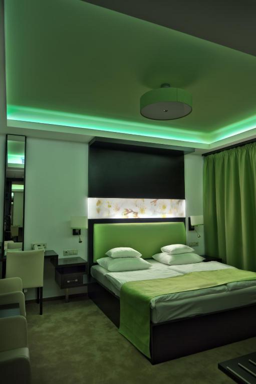 Posteľ alebo postele v izbe v ubytovaní Corso Boutique Hotel