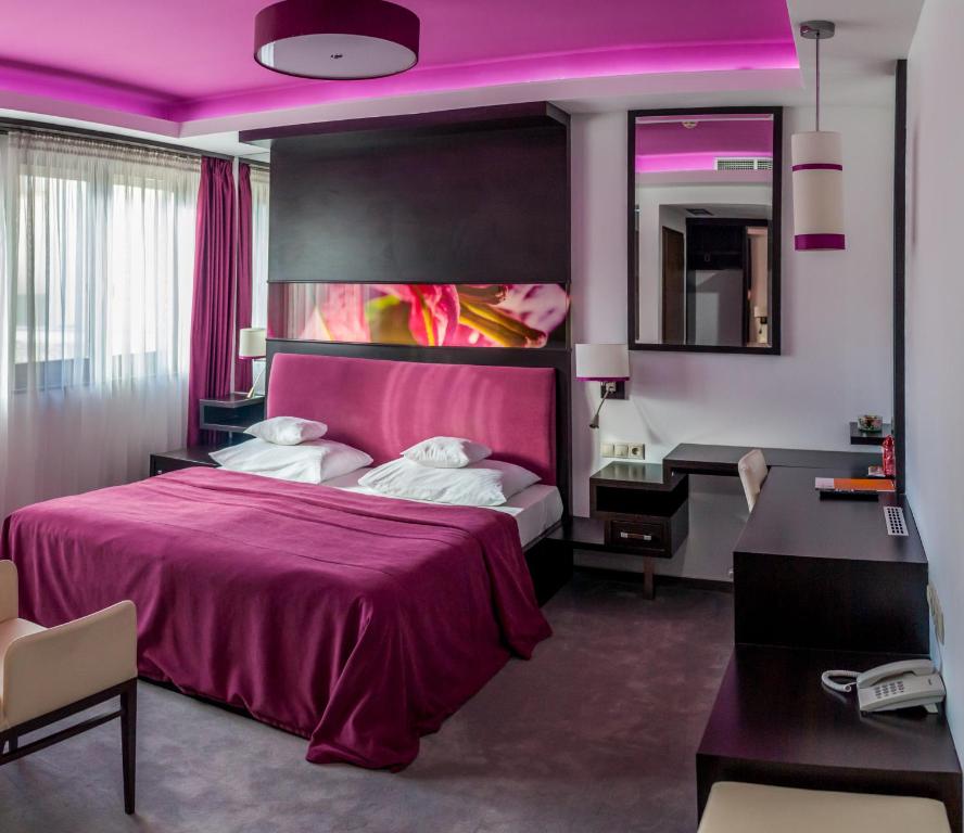 Posteľ alebo postele v izbe v ubytovaní Corso Boutique Hotel