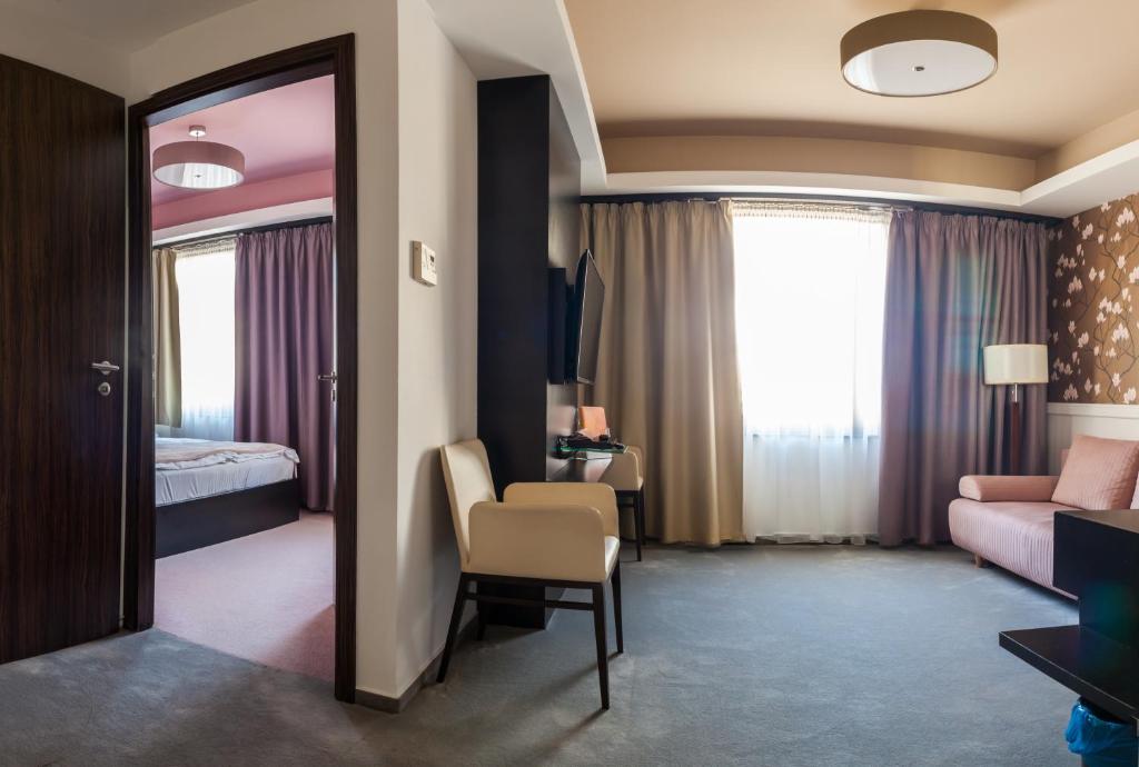 Posteľ alebo postele v izbe v ubytovaní Corso Boutique Hotel