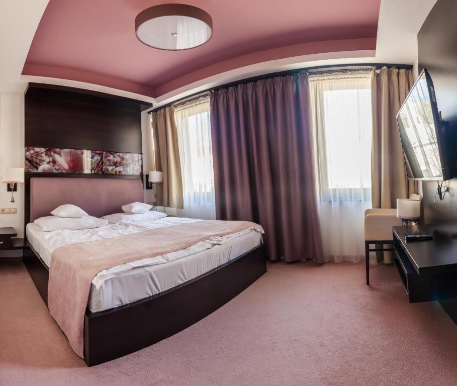 Posteľ alebo postele v izbe v ubytovaní Corso Boutique Hotel