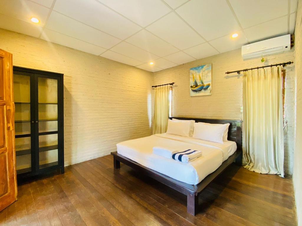 Postel nebo postele na pokoji v ubytování Beachouse Lovina