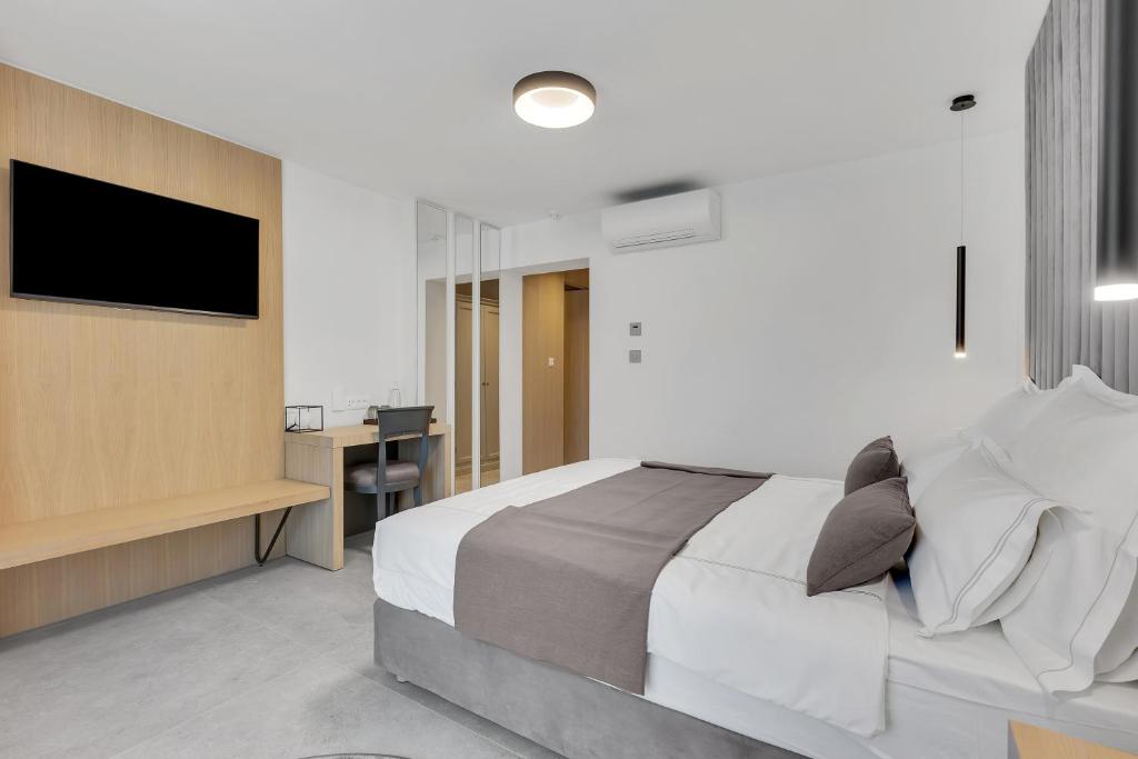 Postel nebo postele na pokoji v ubytování Hotel Laurentum