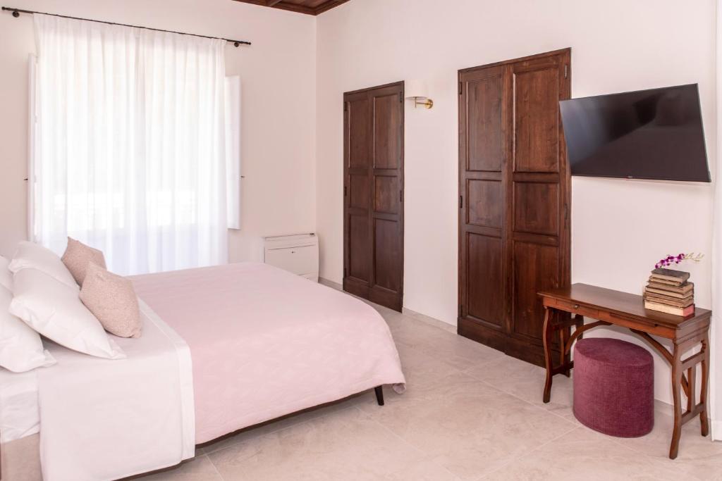 Postel nebo postele na pokoji v ubytování Villa Tuzzo