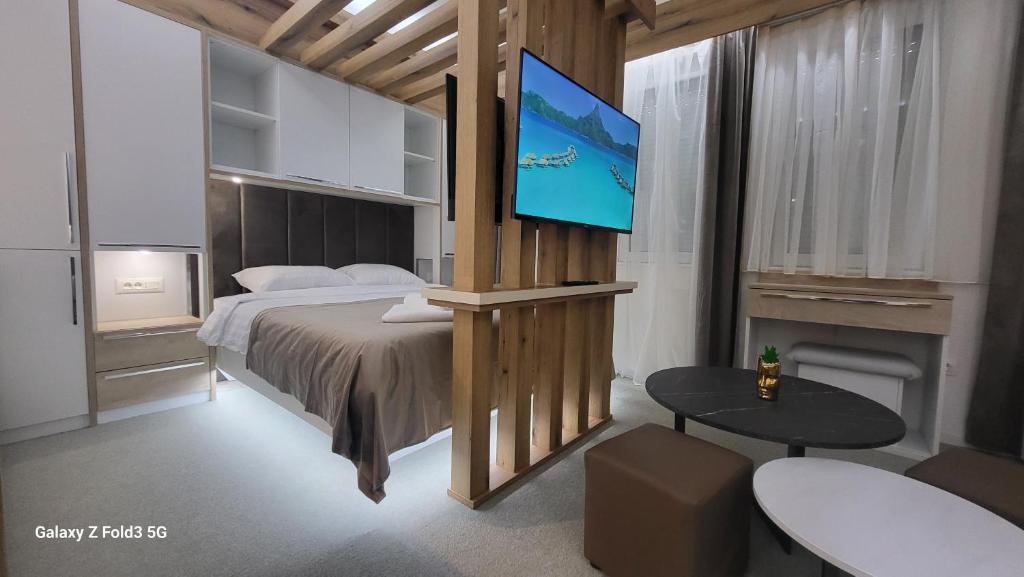 Llit o llits en una habitació de Global Apartments