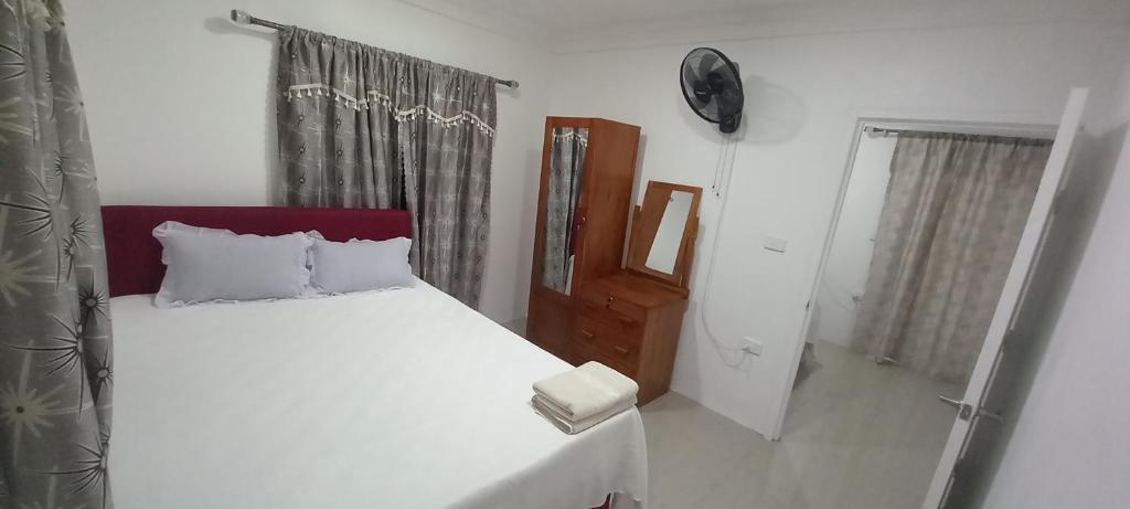 Postel nebo postele na pokoji v ubytování Gounders Apartmemt