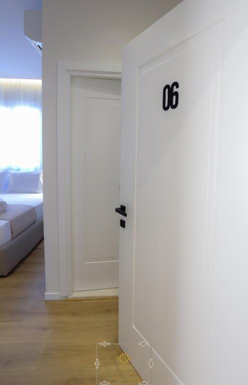 Postel nebo postele na pokoji v ubytování HM Boutique Hotel