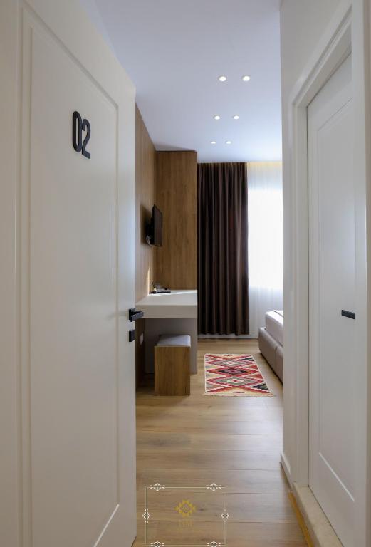 Postel nebo postele na pokoji v ubytování HM Boutique Hotel