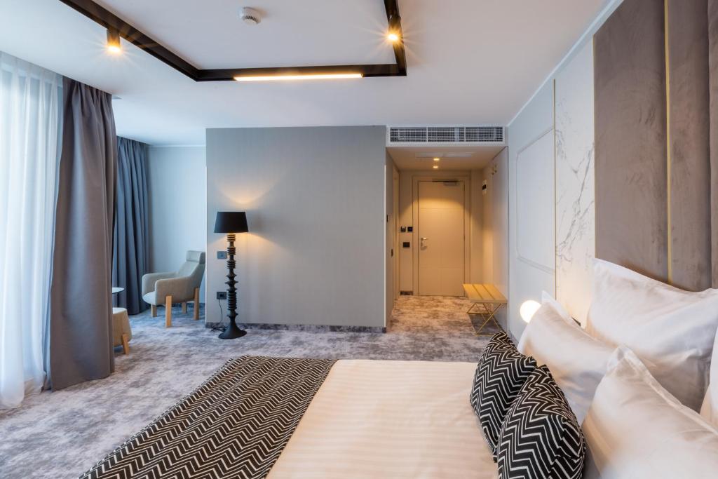 Postel nebo postele na pokoji v ubytování Hotel Lupa by Bueno
