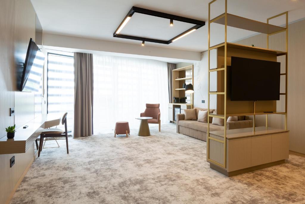 TV a/nebo společenská místnost v ubytování Hotel Lupa by Bueno