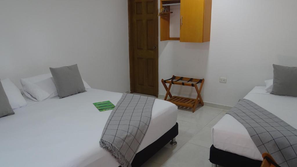 Postel nebo postele na pokoji v ubytování Hotel Casa Finca La Maracuya