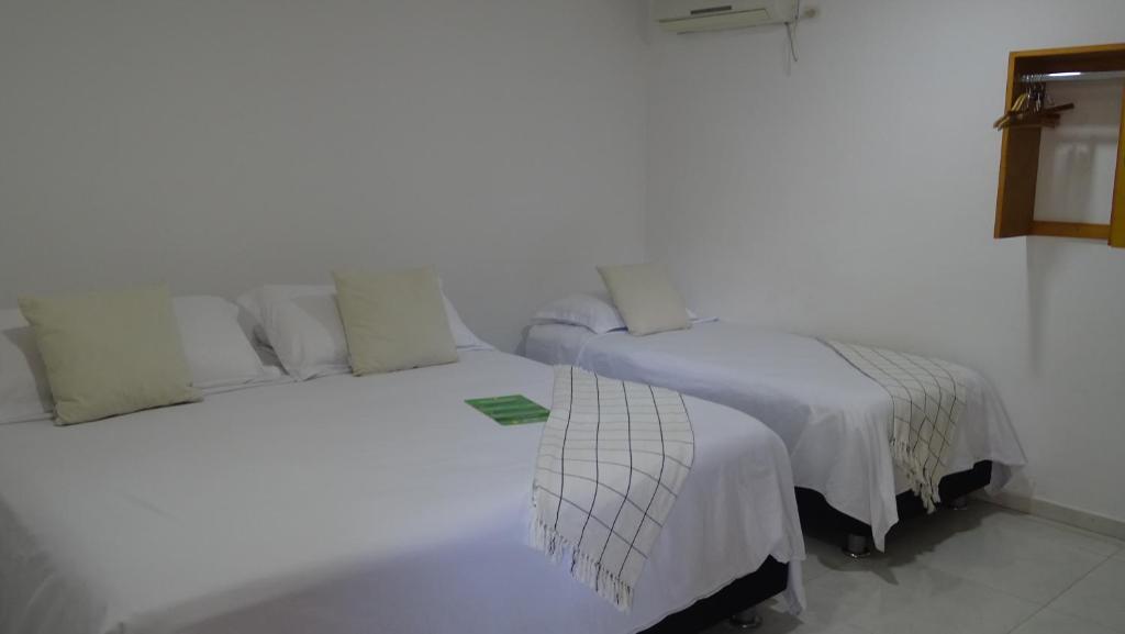 Postel nebo postele na pokoji v ubytování Hotel Casa Finca La Maracuya
